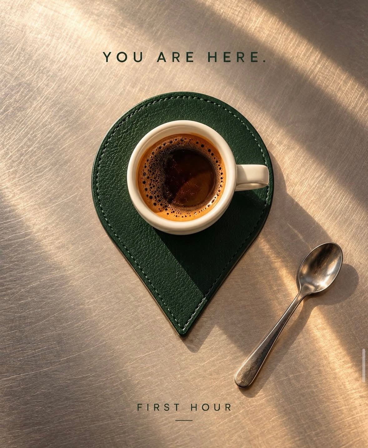 A green First Hour cup on a leather coaster beside the words You are here.